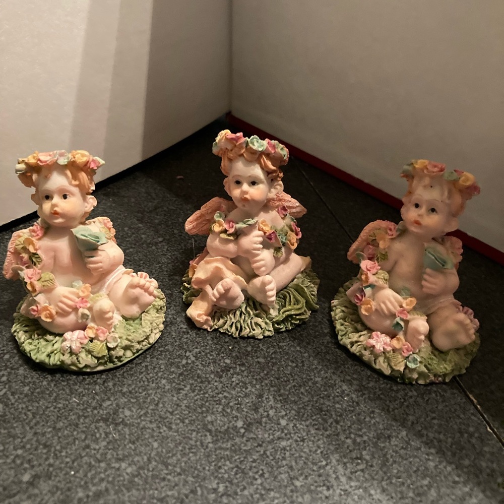 Three small miniature angels cute for displaying